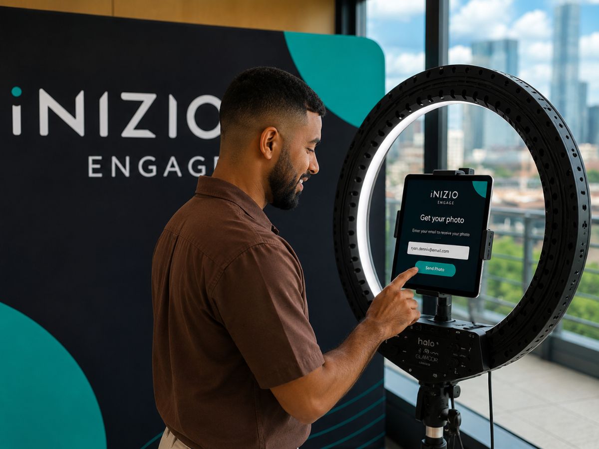 Guest entering their email on a selfie pod tablet to receive their branded photo