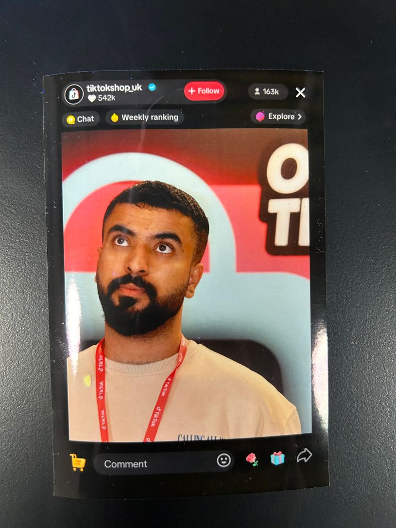 Personalised TikTok portrait print handed to an employee at the event