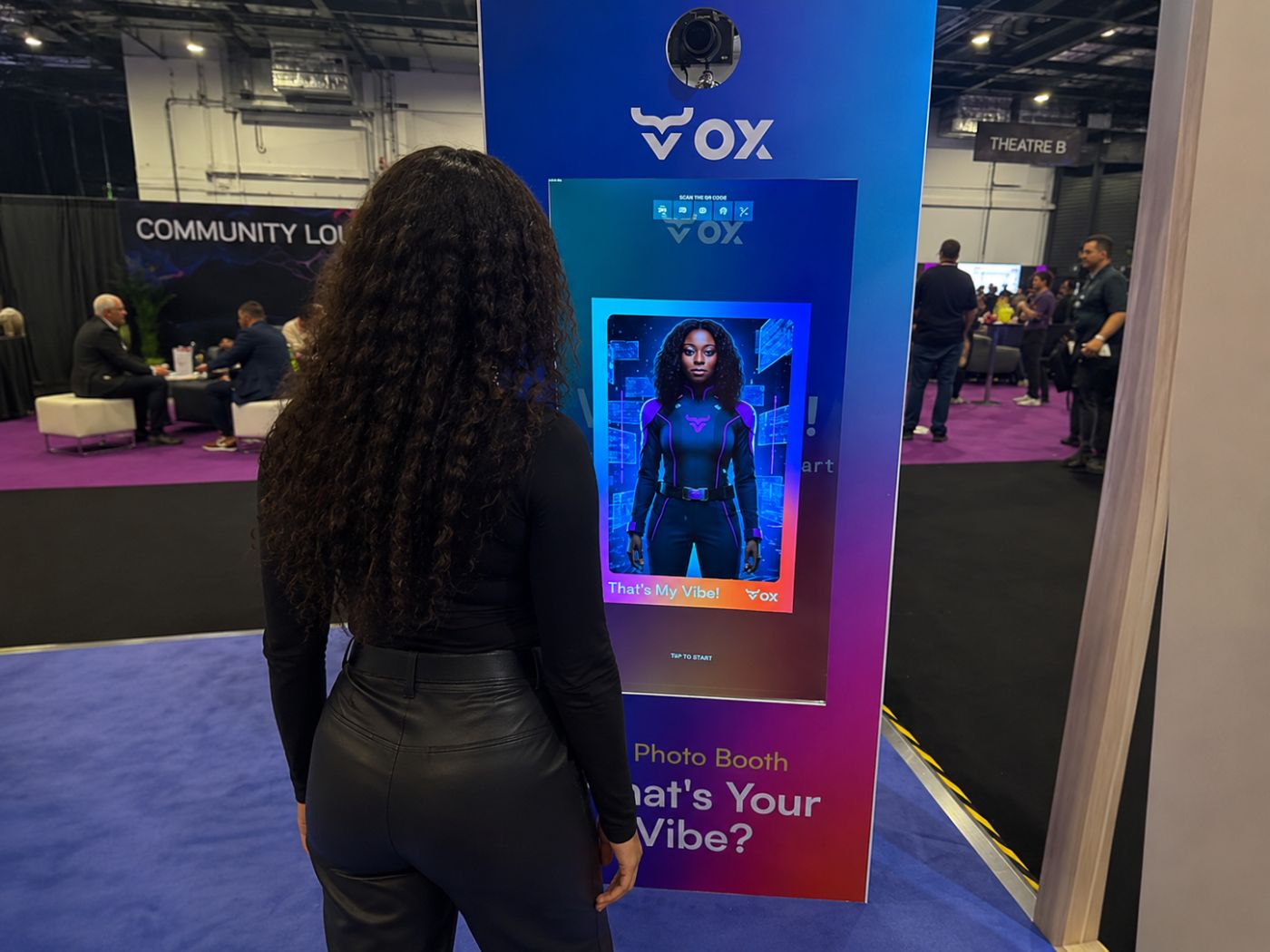 Guest using a branded selfie pod at a corporate technology conference in London