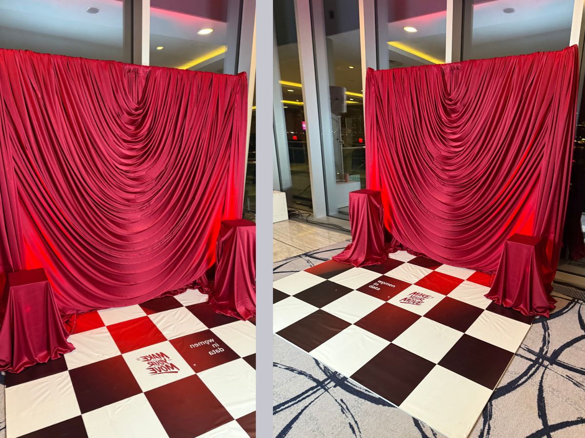 Finished Women in Data installation with luxury draped backdrop and branded chequerboard flooring