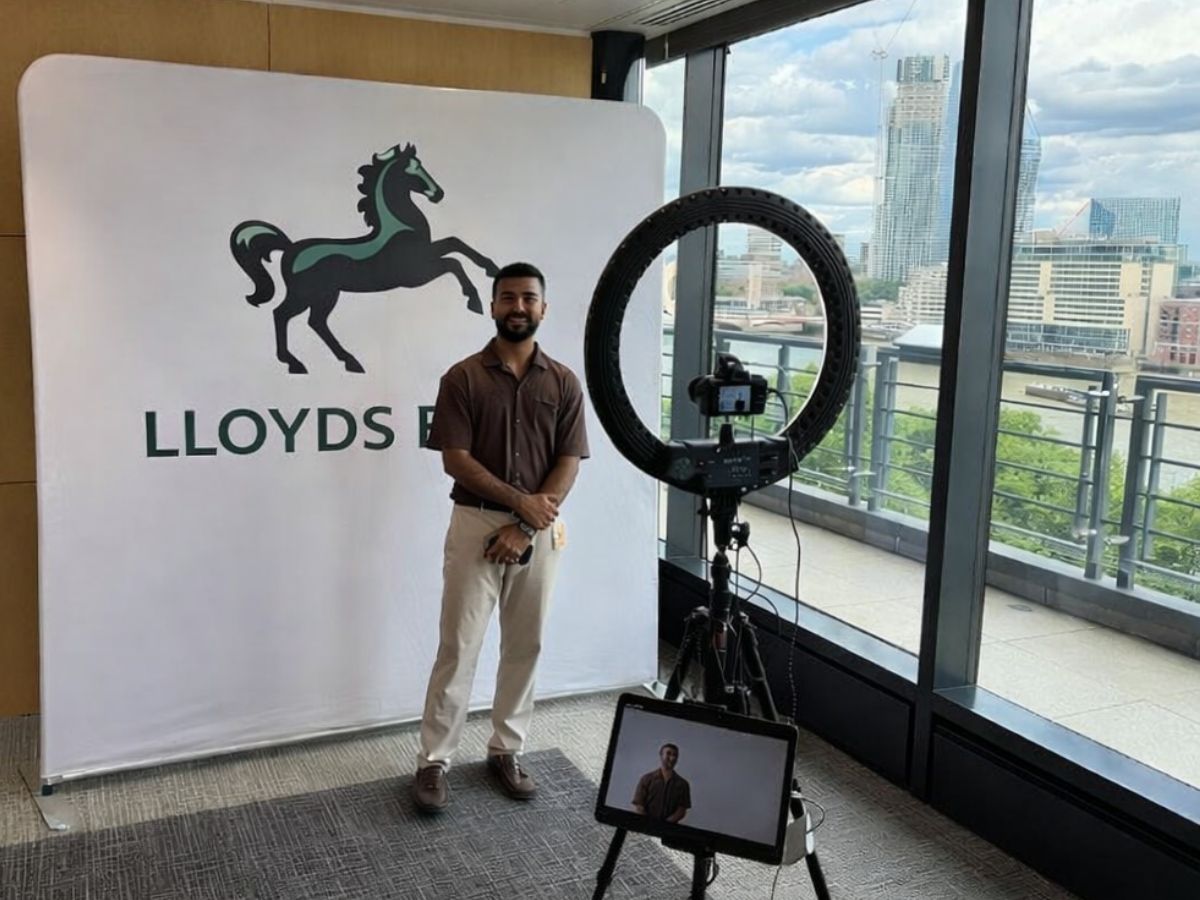 Branded fabric backdrop and ring light studio set up at a corporate office event in London