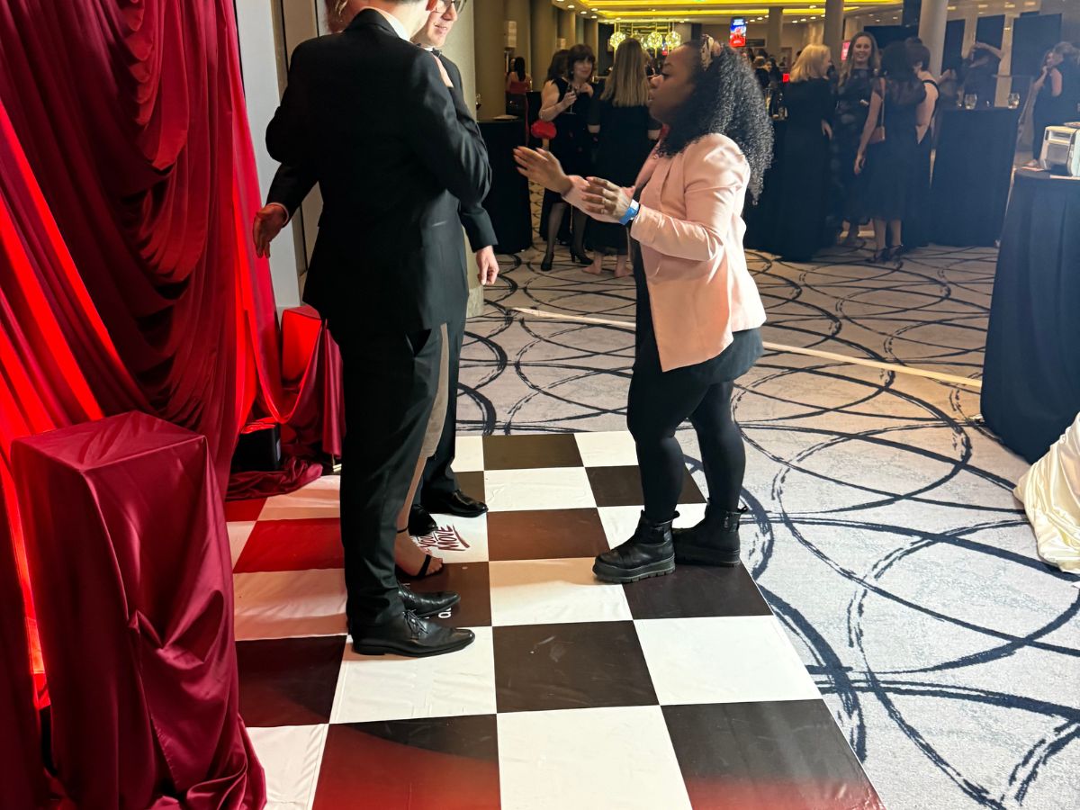 Guests enjoying the Women in Data branded photo activation as the gala gets underway