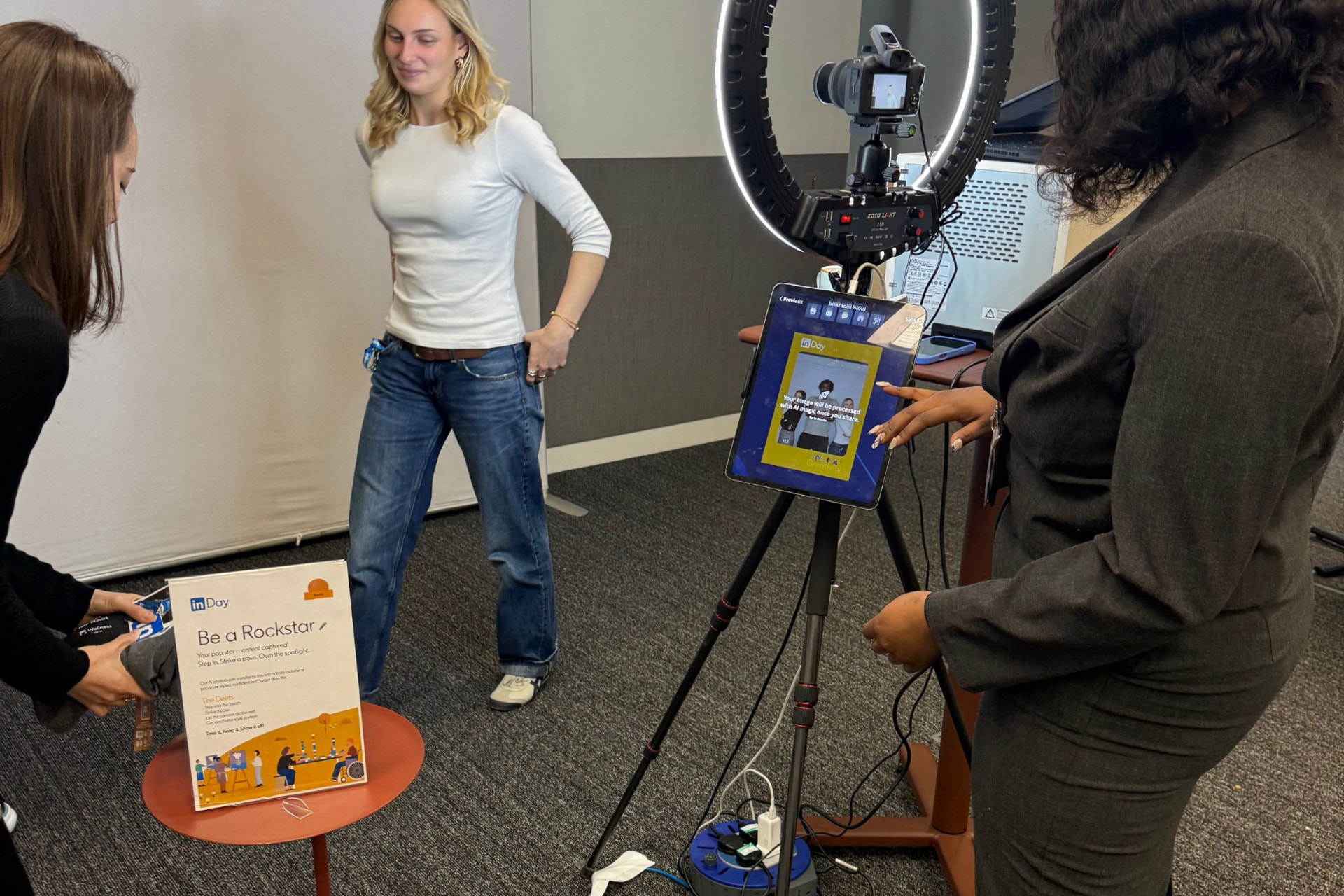 LinkedIn guests using the branded AI photo booth inside the LinkedIn HQ London event space